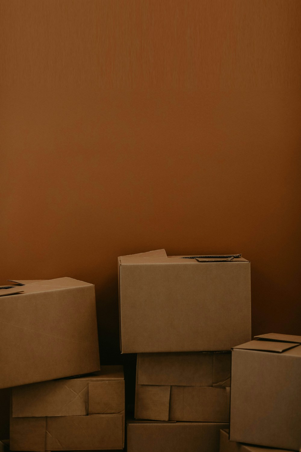 Stacked brown cardboard boxes